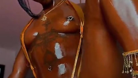 Hot ebony enjoys a colourful dildo in her pussy